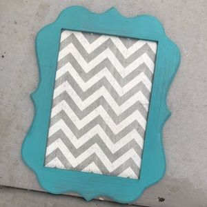 Turquoise frame with magnet background.